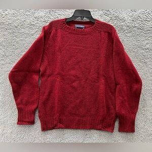 This is a vintage Robert Bruce crew neck sweater made of red wool.